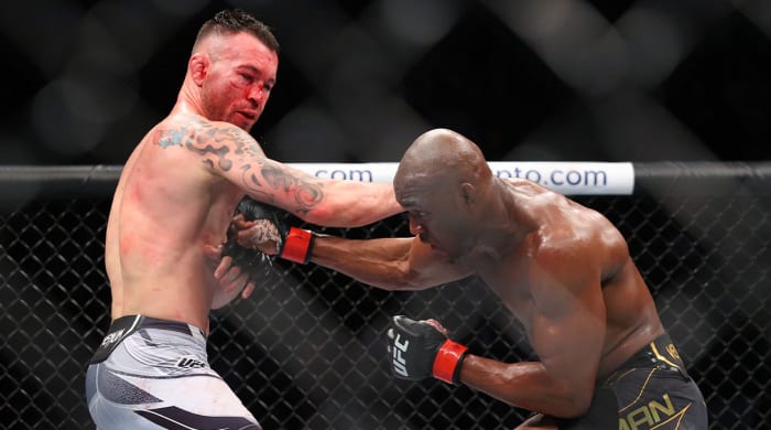 Nov 6, 2021; New York, NY, USA; Kamaru Usman (red gloves) competes against Colby Covington (blue gloves) during UFC 268 at Madison Square Garden.